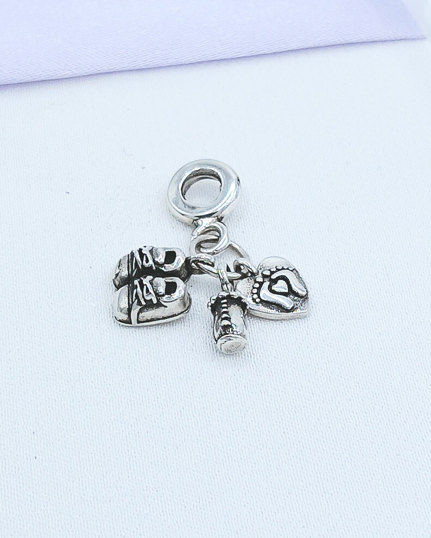 Dije charm baby biberón, zapatitos y huellitas