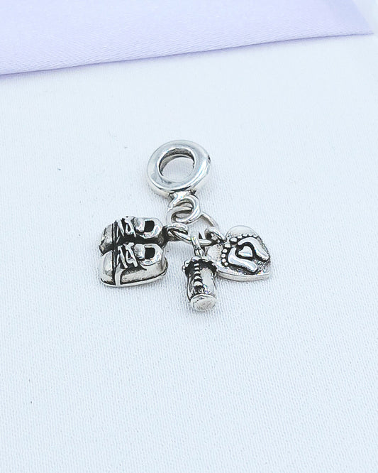 Dije charm baby biberón, zapatitos y huellitas